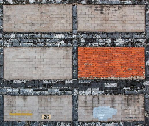 Brick wall, with one panel of red bricks